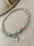 Ketting mintgroen-oranje/koraal