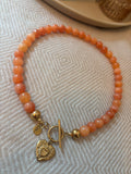 Ketting oranje met bedel